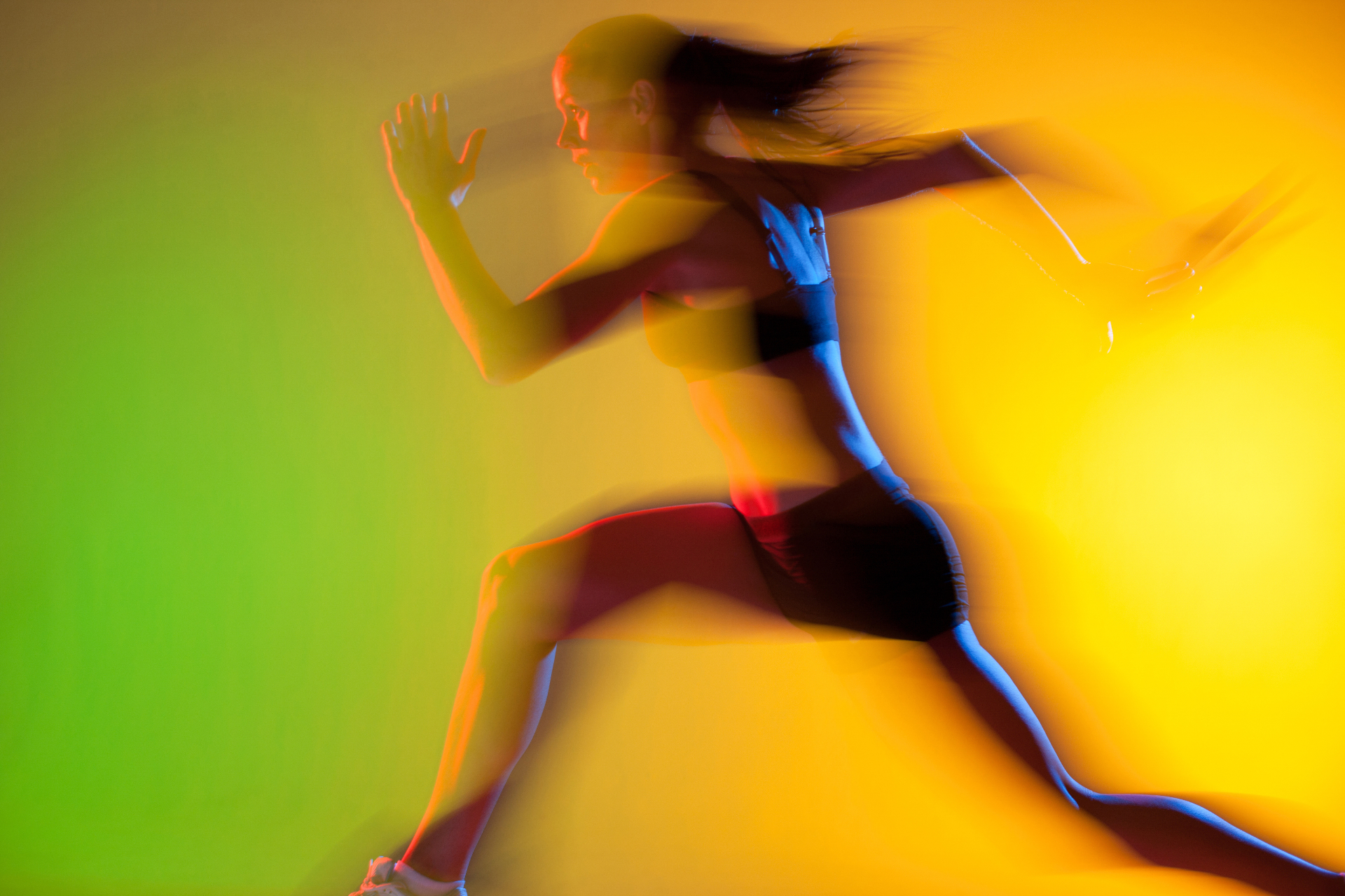 Athlete in motion on a vibrant colour background